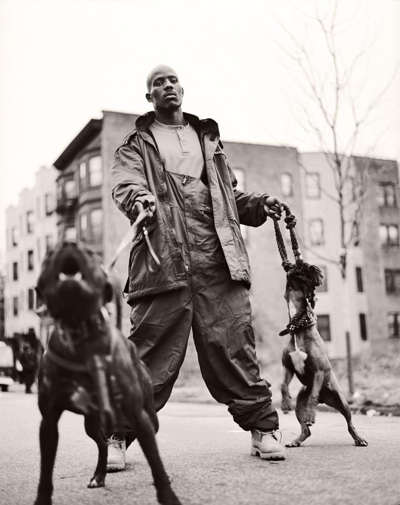 Dark Man X with his dogs. shot by Jonathan Mannion